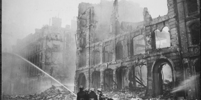 Firemen at work in London after bombing raid 1941